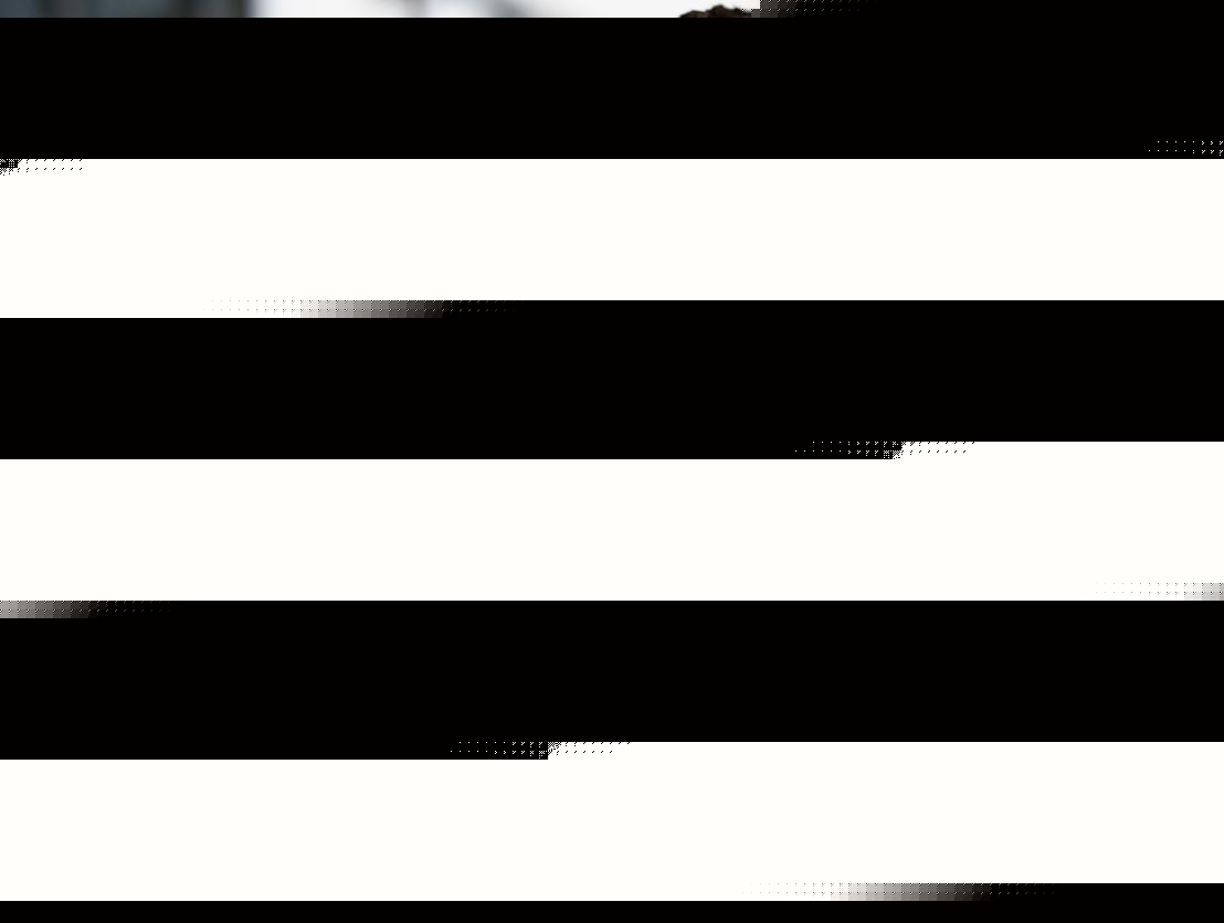 Two builders working in AWS Infrastructure Services view a tablet together outside an AWS office.